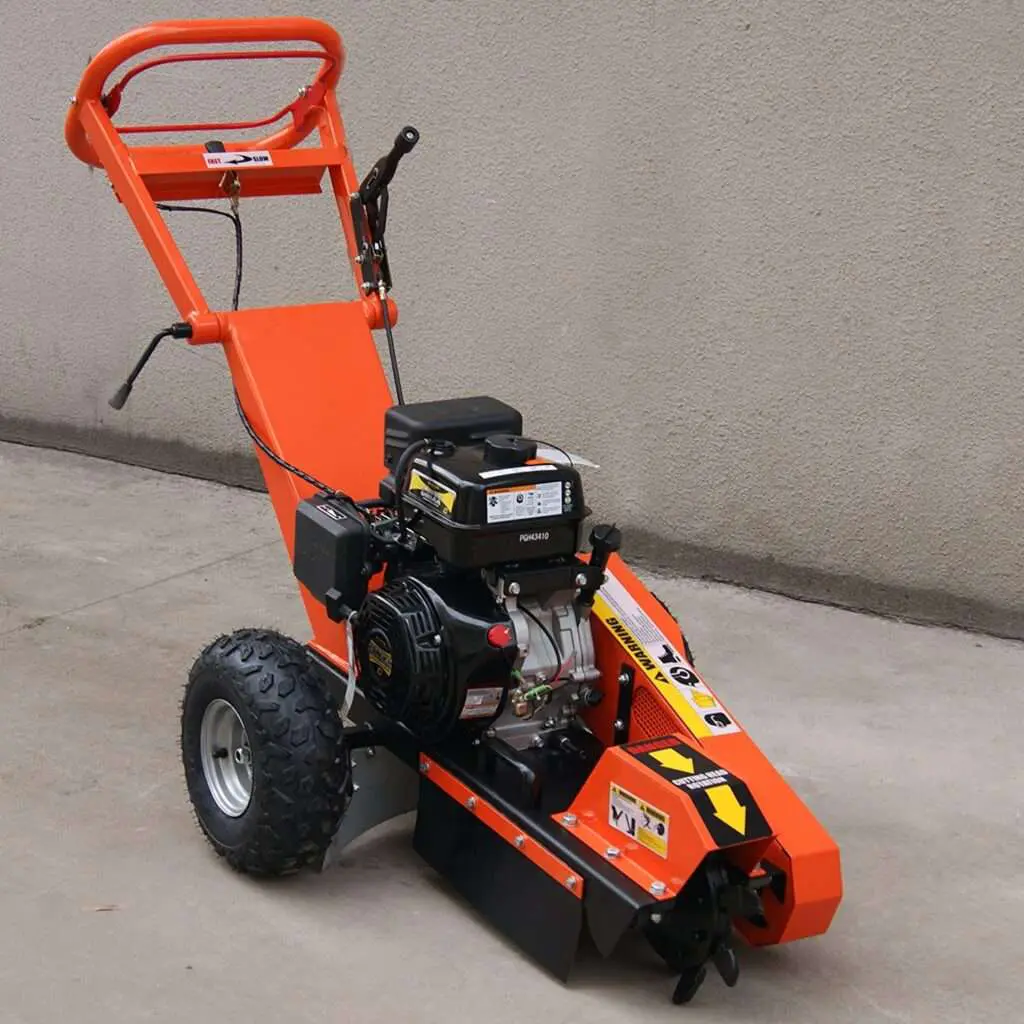 Orange wheeled stump grinder standing on a concrete floor